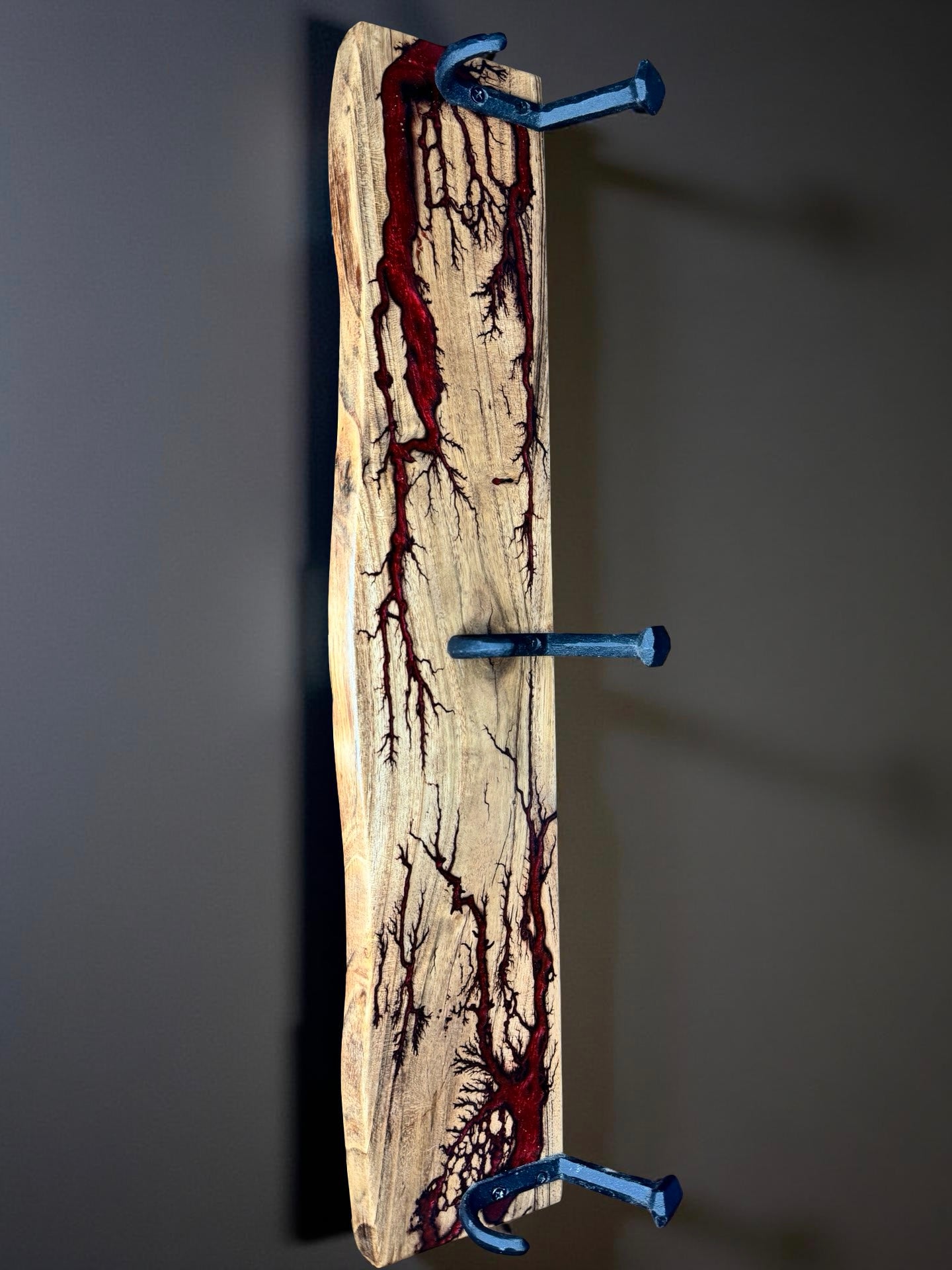 Red resin coat rack with sleek metal hooks, premium Australian home styling